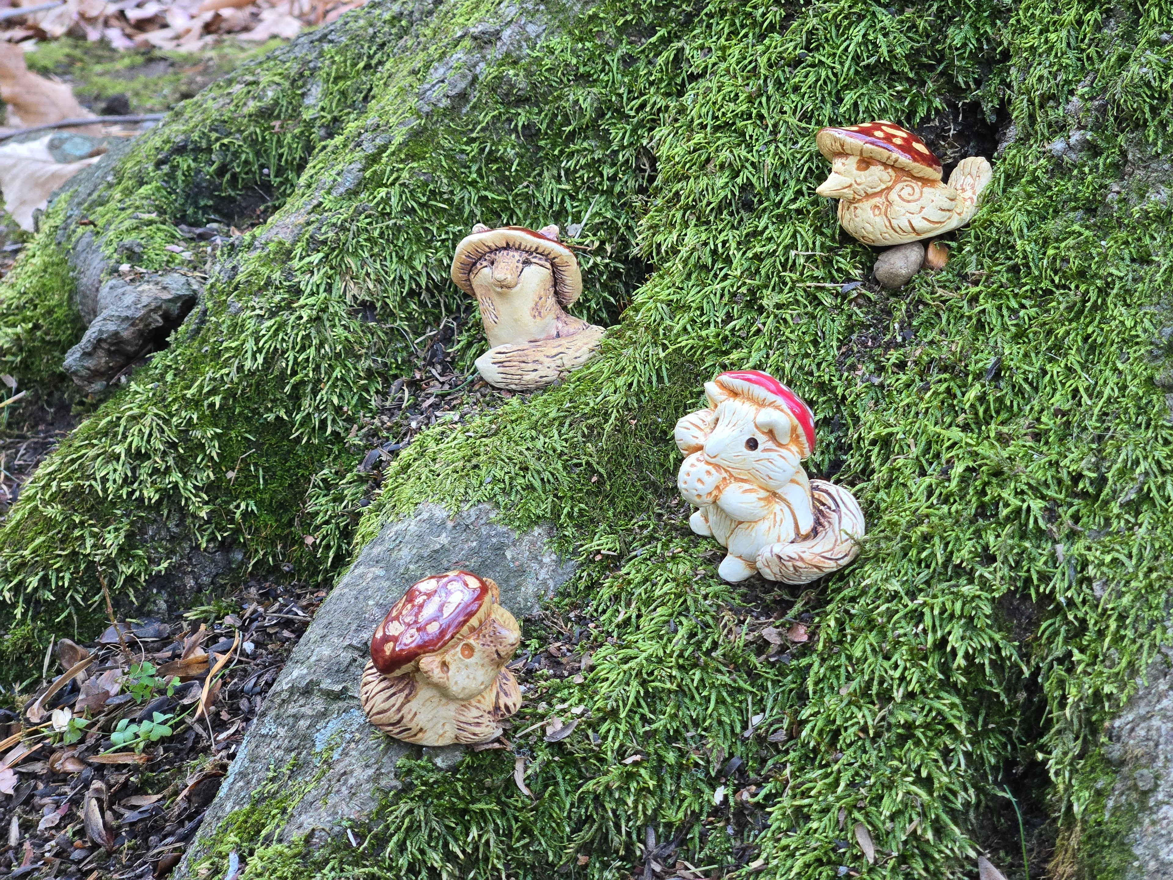 Mushroom Cap wearing animals on a mossy tree stump